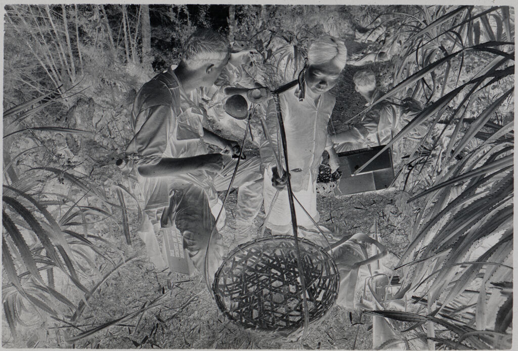 Untitled (Soldiers Resting On Path And Civilian Woman Hanging Large Basket, Vietnam)