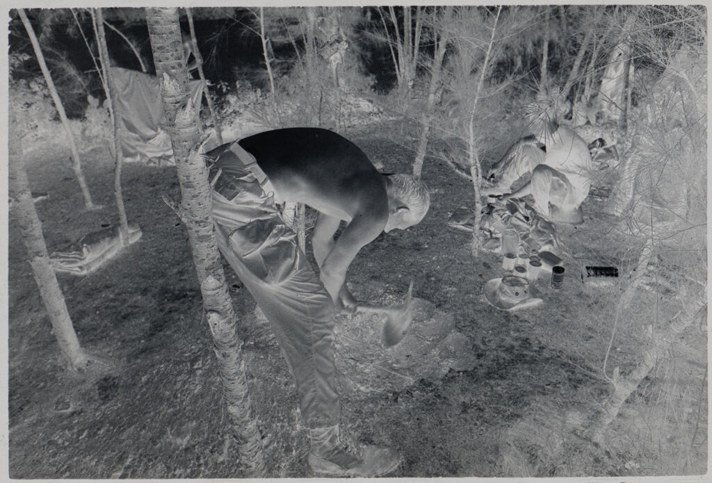 Untitled (Soldier Digging Hole In Small Clearing, Vietnam)