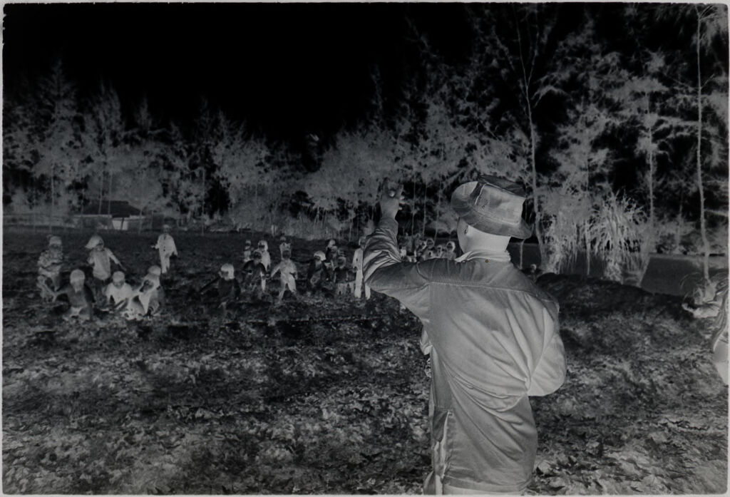 Untitled (Soldier And Group Of Children Playing In Field, Vietnam)