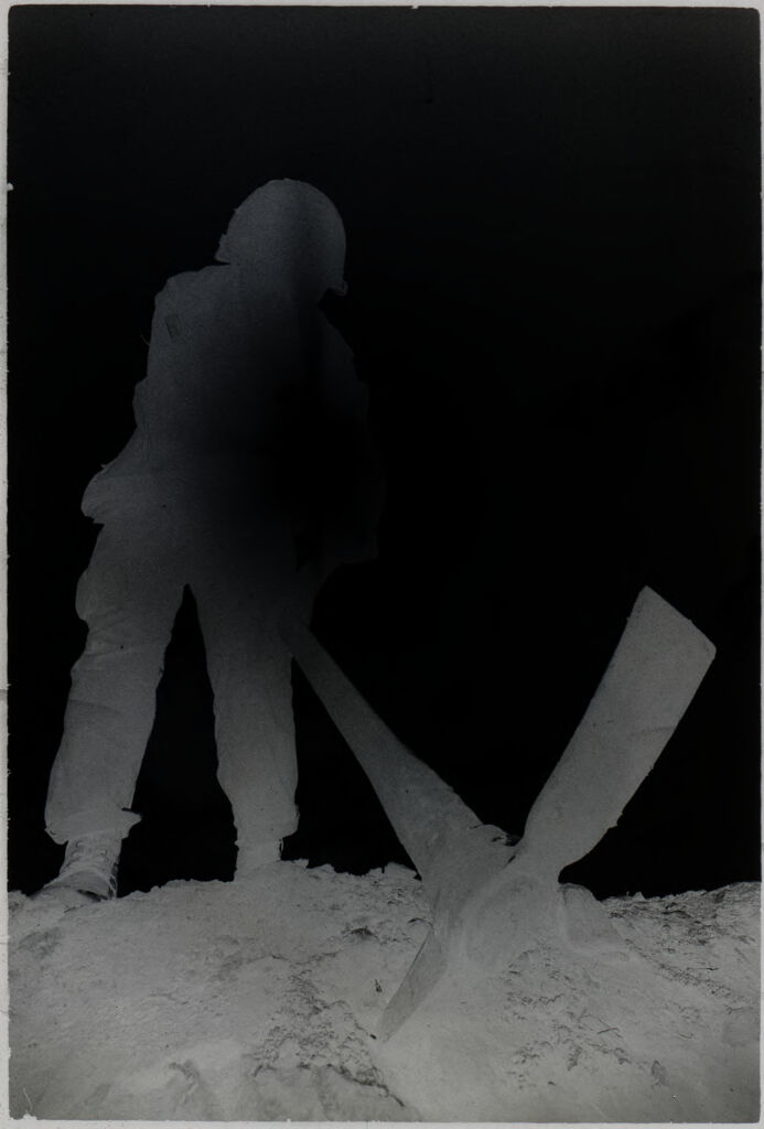 Untitled (Soldier With Pickaxe Silhouetted Against The Sun, Vietnam)