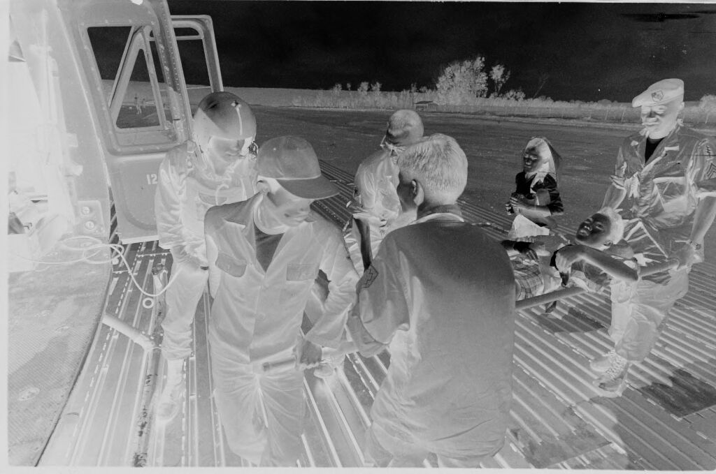 Untitled (Medevac Team Loading Wounded Into Helicopter, Vietnam)