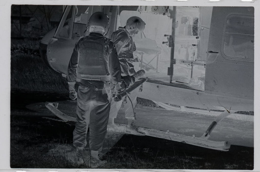Untitled (Soldiers Awaiting Arrival Of Medevac Helicopter, Vietnam)