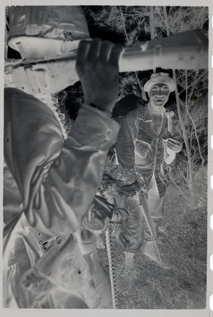 Untitled (Two Soldiers Stopped On Trail To Talk, Vietnam)