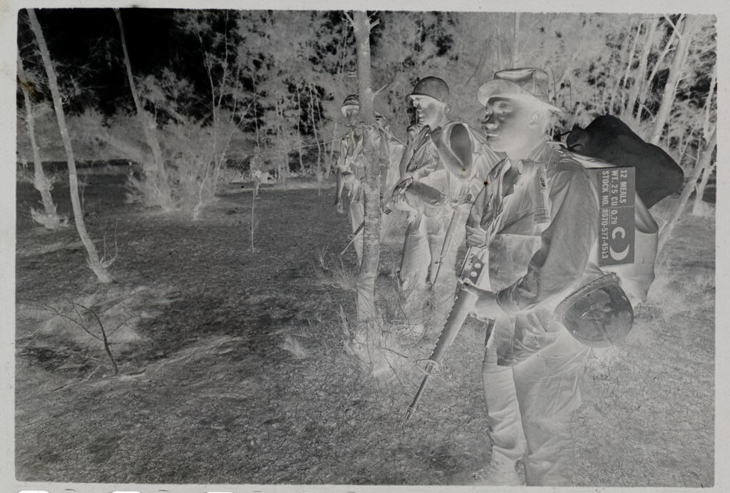 Untitled (Soldiers Adjusting Gear, Vietnam)