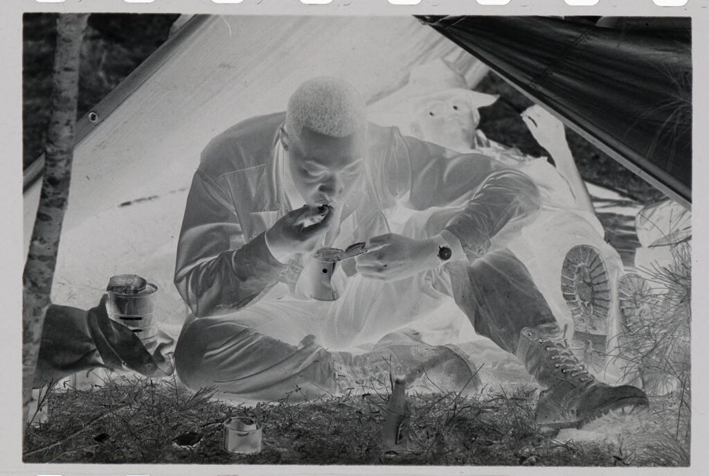 Untitled (Soldier Eating Canned Food Under A Make-Shift Tent, Vietnam)