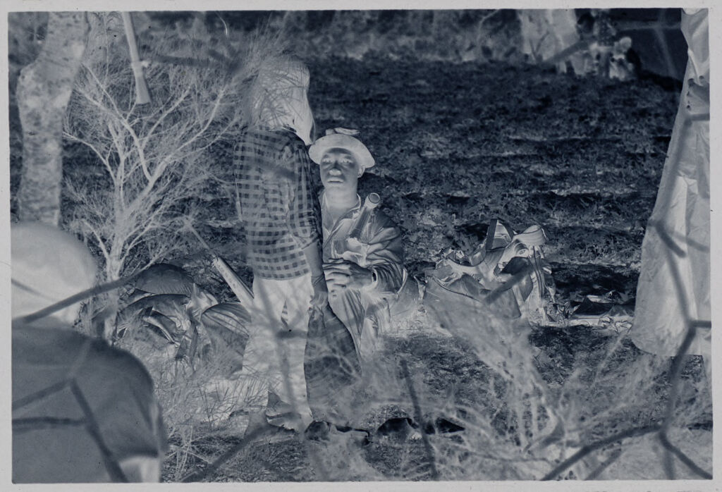 Untitled (Soldier Seated On Ground Talking With Vietnamese Girl, Vietnam)