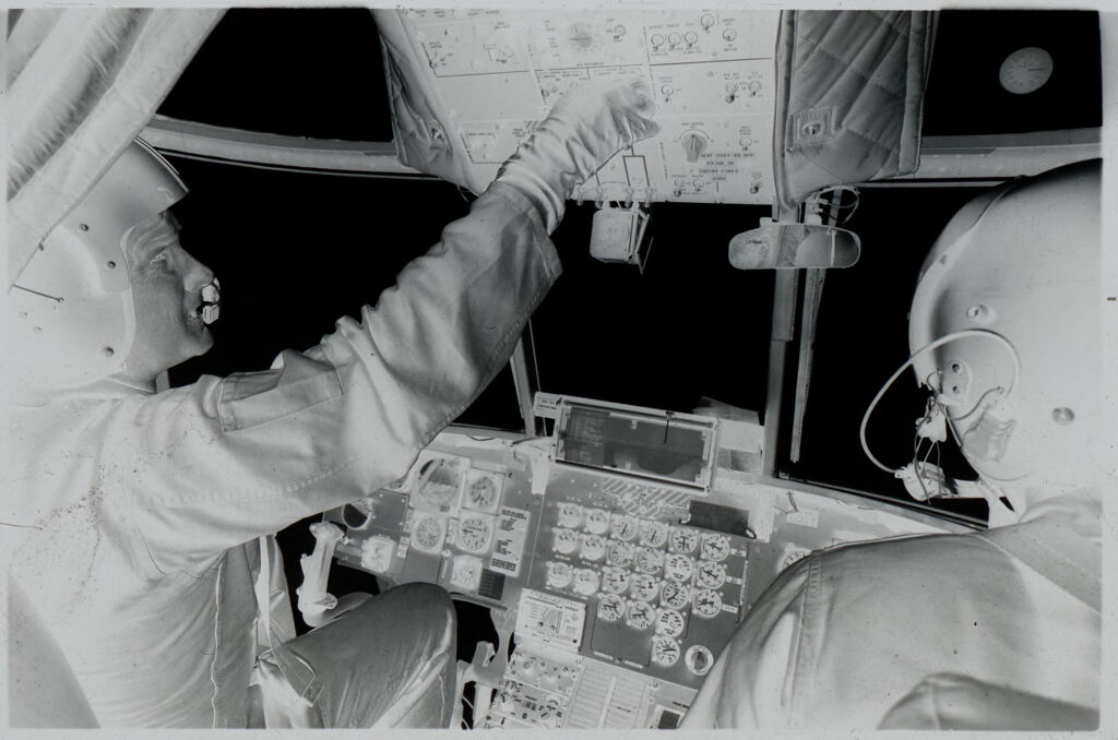 Untitled (Soldier In Helicopter Cockpit Adjusting Overhead Controls, Vietnam)
