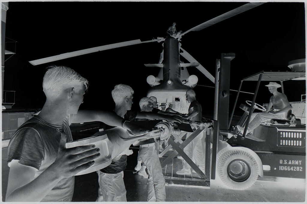 Untitled (Soldiers Working On Helicopter Rotor Blade, Vietnam)