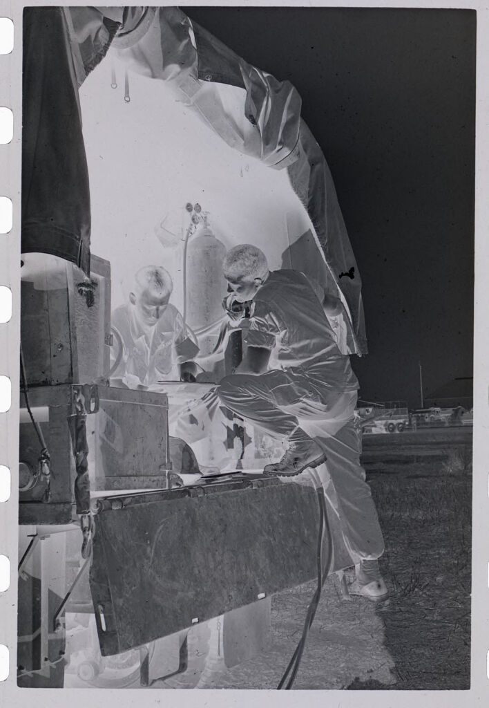 Untitled (Soldiers Near Opening Of Large Tent Setting Up Equipment, Vietnam)