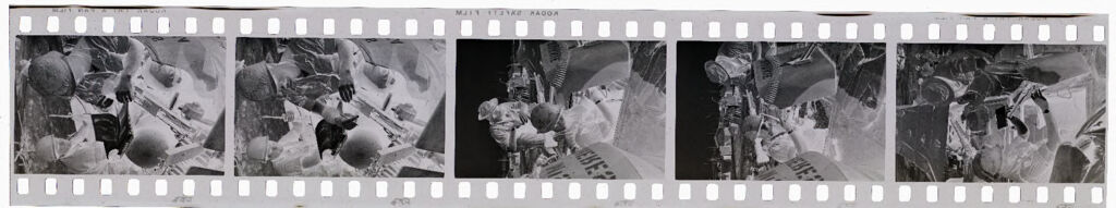Untitled (Soldiers Trading Supplies And Tags; Top Of Soldier's Head Through Circular Tank Window, Vietnam)