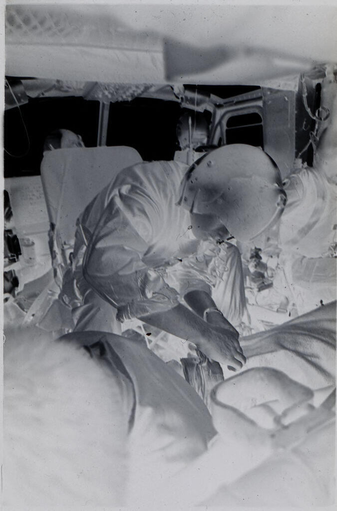 Untitled (Medic Inside Helicopter Treating Wounded Soldier, Vietnam)