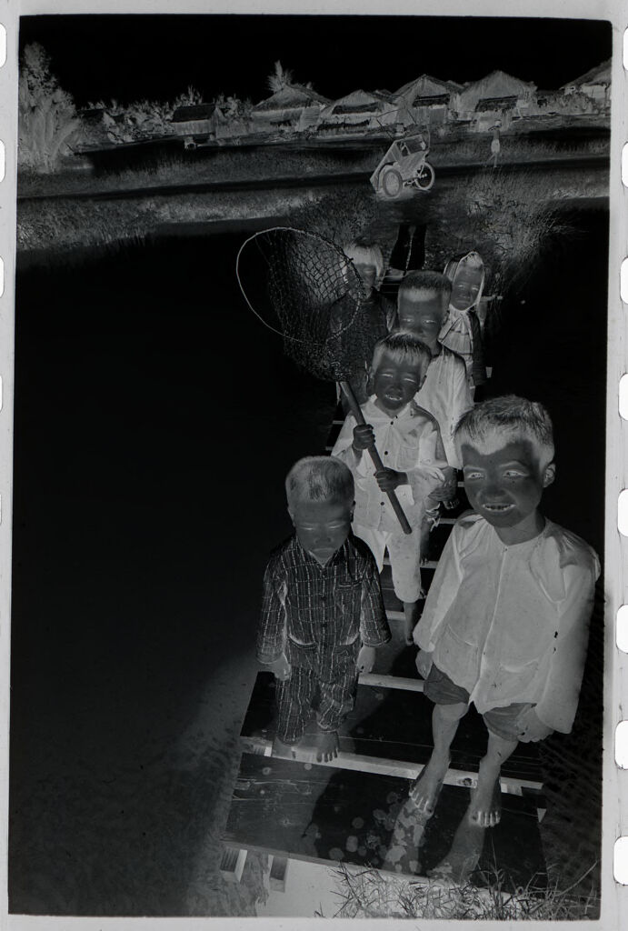 Untitled (Children With Fishing Nets Standing On Dock, Vietnam)