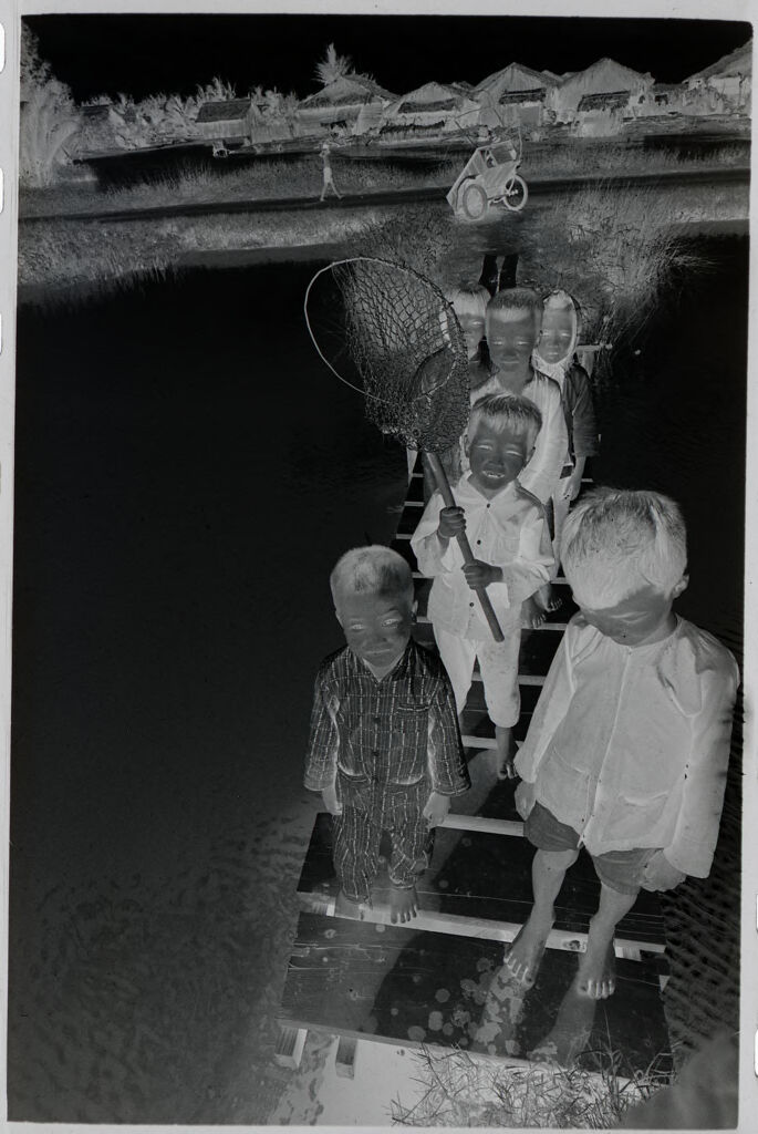 Untitled (Children With Fishing Nets Standing On Dock, Vietnam)