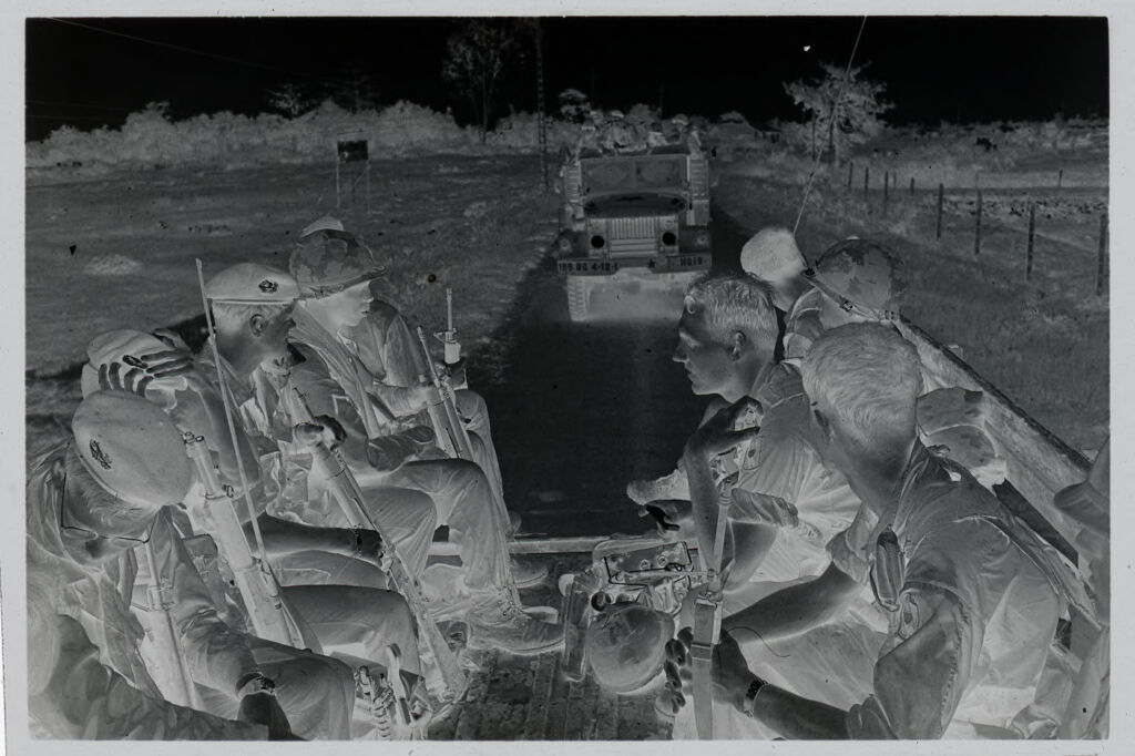 Untitled (Soldiers In Combat Gear Riding In Back Of Army Truck, Vietnam)