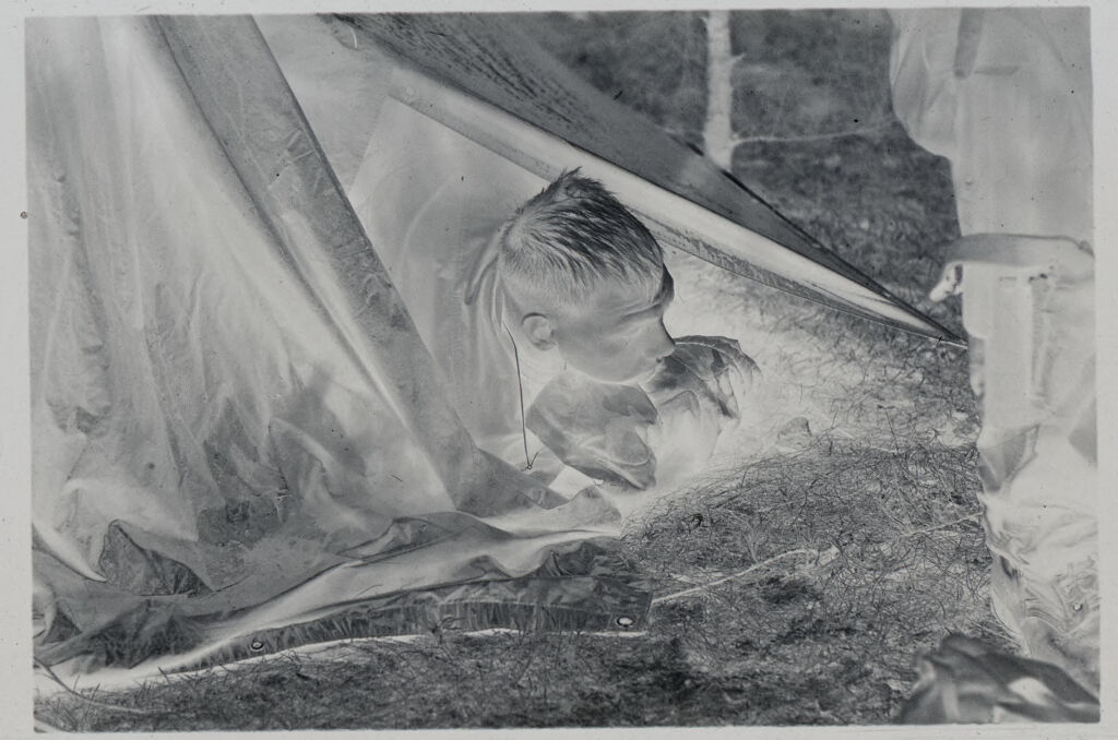 Untitled (Soldier Poking His Head Through Opening In Tent, Vietnam)