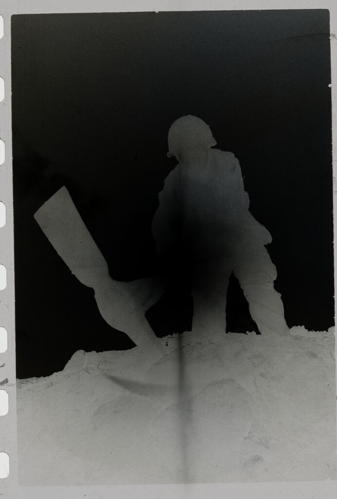 Untitled (Soldier With Pickaxe Silhouetted Against The Sun, Vietnam)