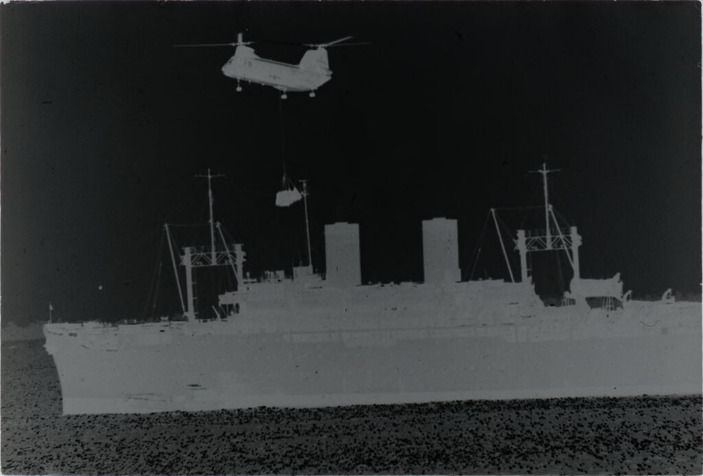 Untitled (Chinook Helicopter Dangling Cargo Hovering Above Navy Ship, Vietnam)