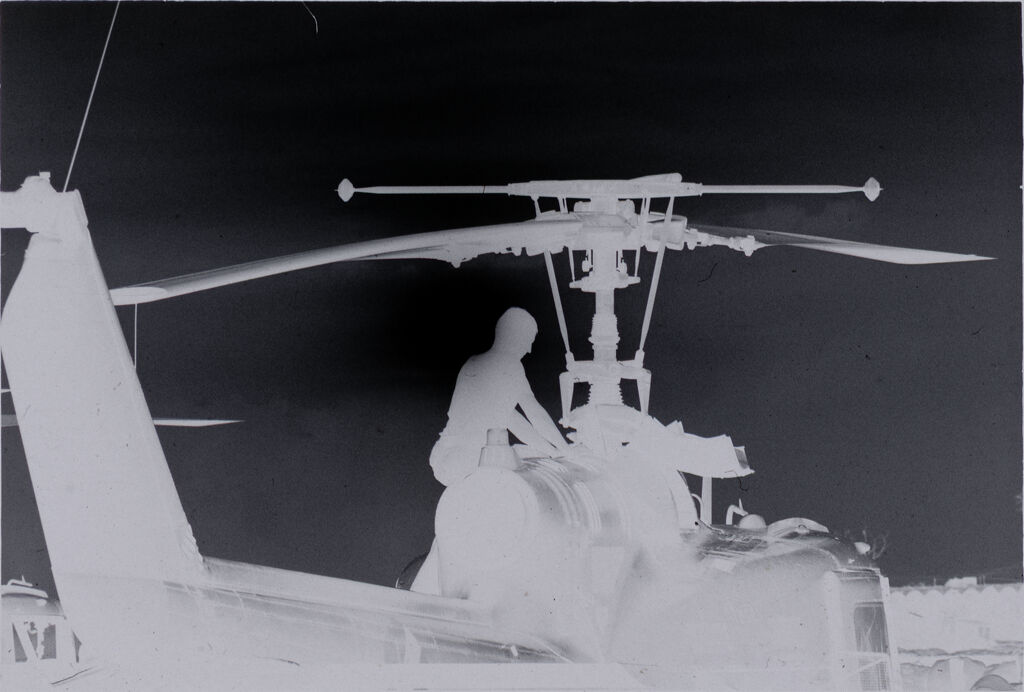Untitled (Soldier Working On Helicopter, Vietnam)