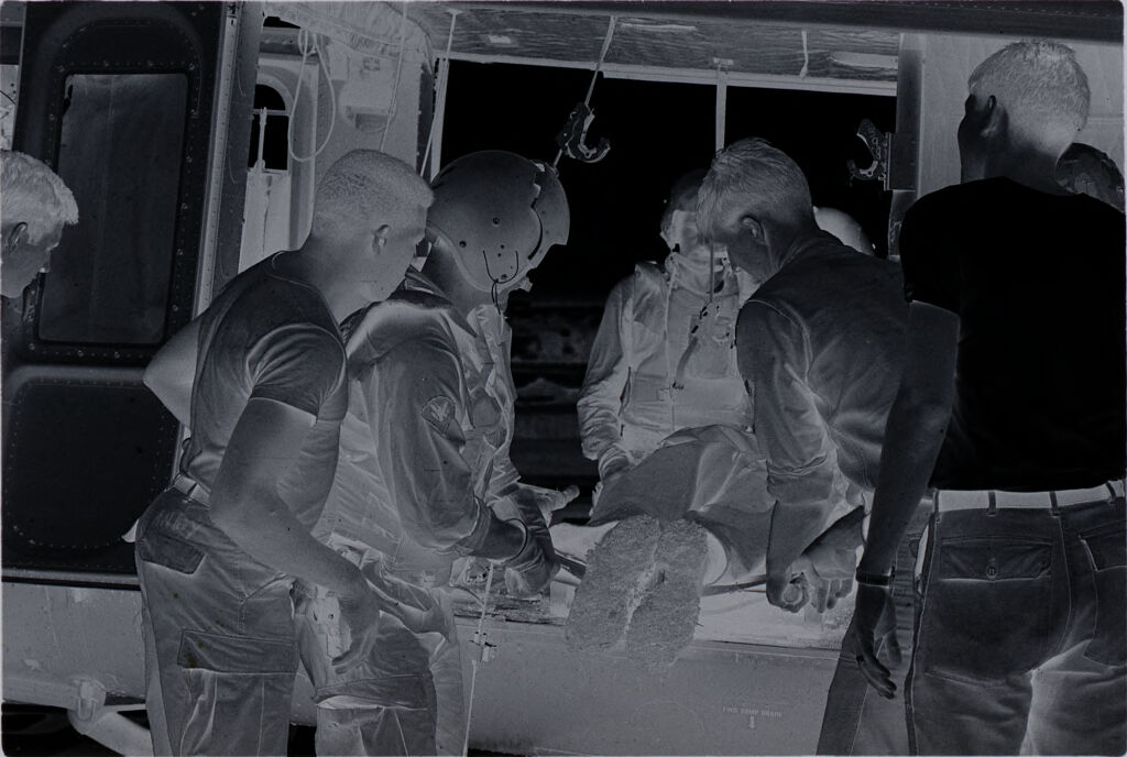 Untitled (Members Of 57Th Medical Detachment Taking Wounded Soldier Out Of Medevac Helicopter, Vietnam)