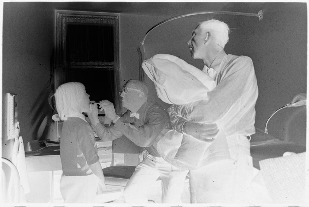 Untitled (Dr. Herman M. Juergens Examining Young Patient With Father Present)